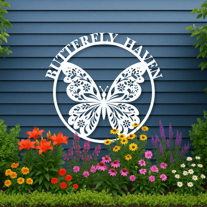 Decorative metal sign with butterfly design and 'Butterfly Haven' text against a blue wooden background.