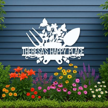 Decorative sign with 'Theresa's Happy Place' on a blue wall with garden flowers below.