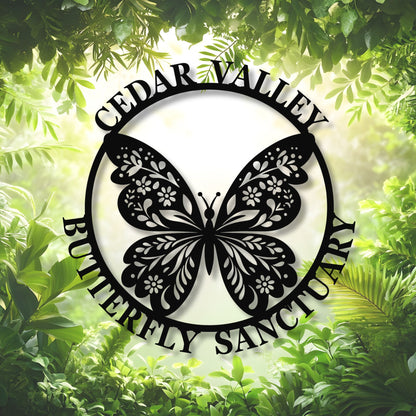 Butterfly sanctuary logo with green foliage in the background