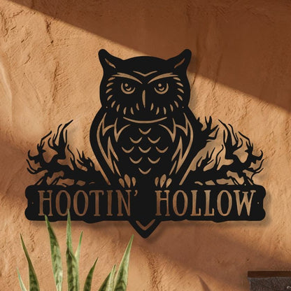 Front entrance of a rustic building with 'Hootin Hollow' sign, door, and potted plants.