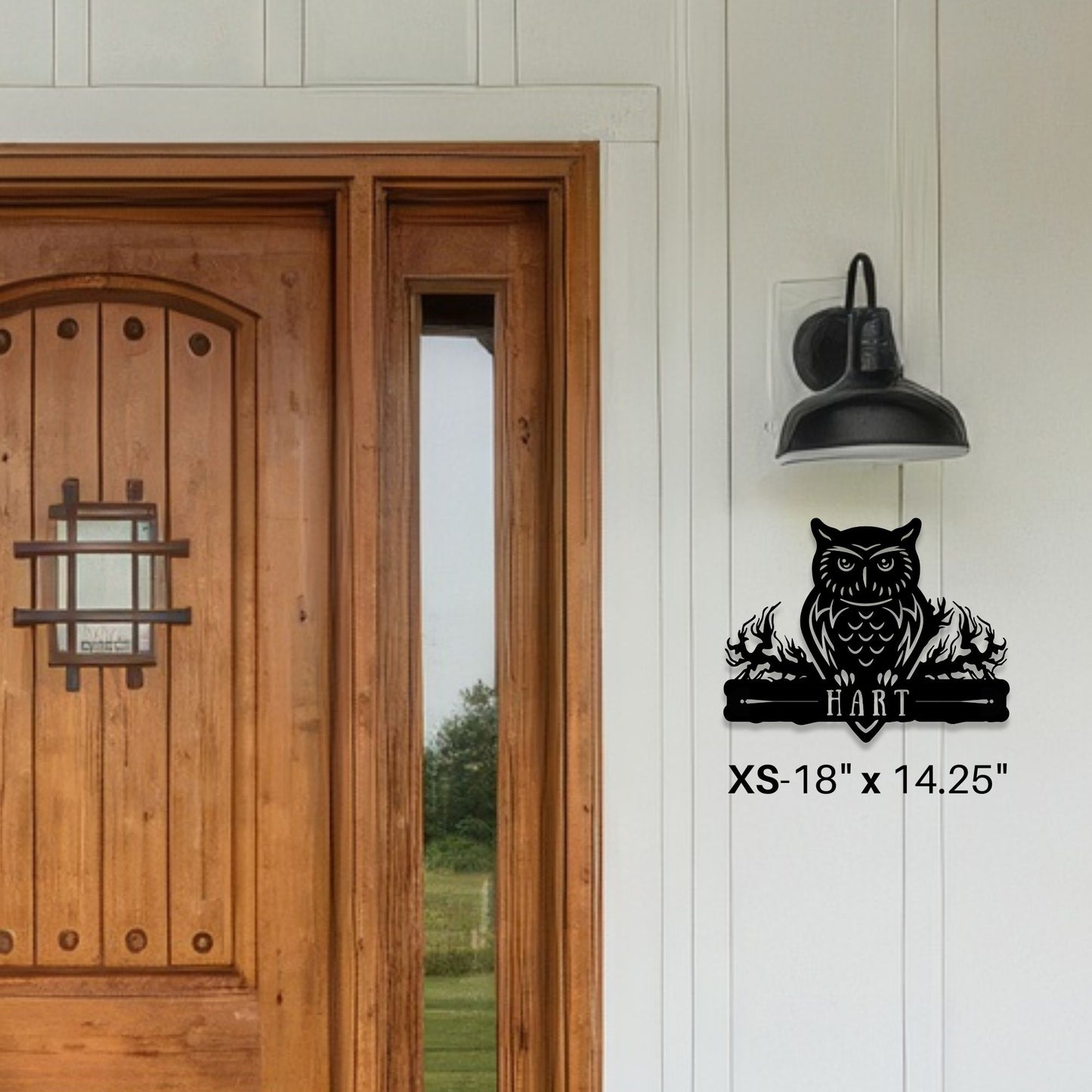 Wooden door with a decorative owl wall decal on a white wall.