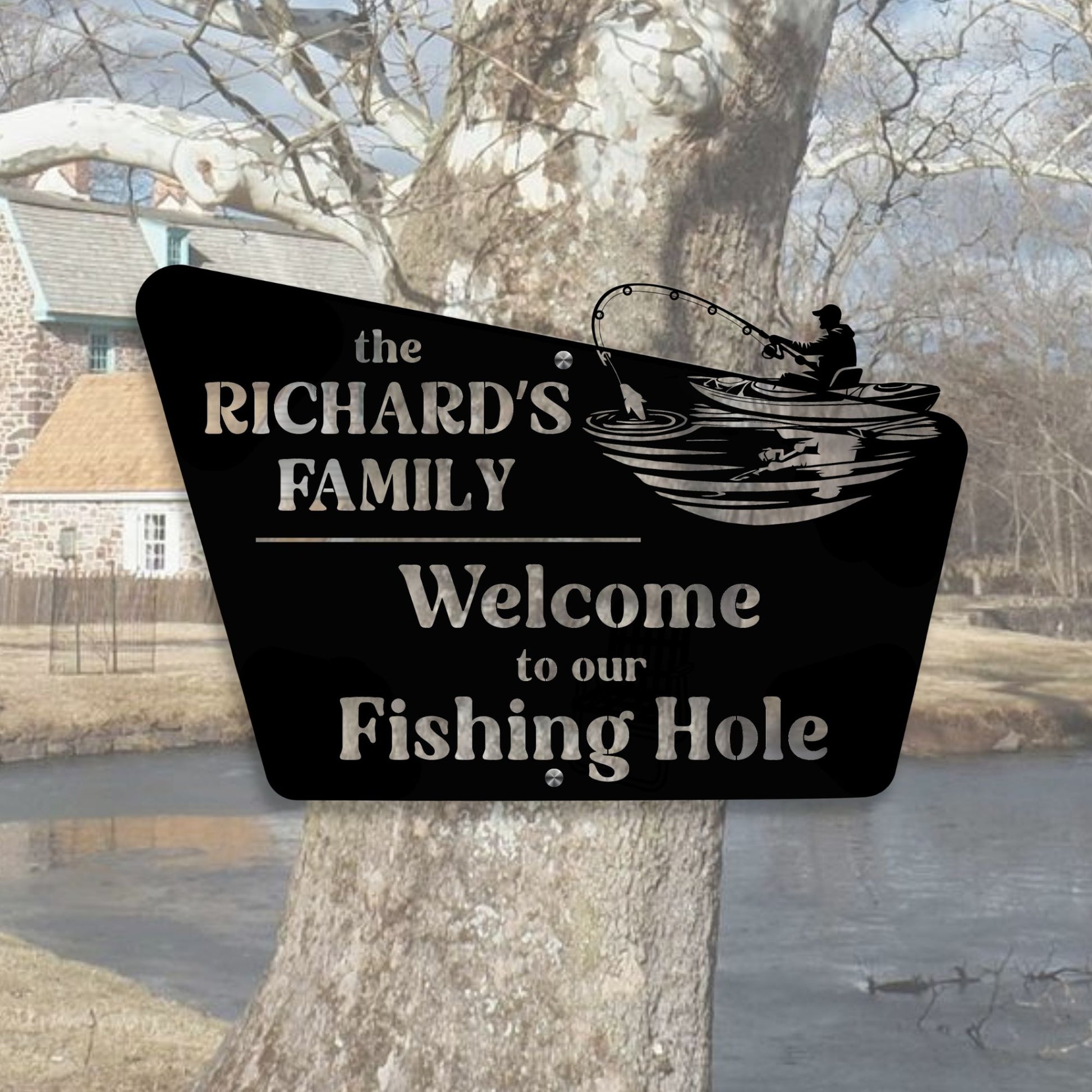Personalized sign with fishing design and text, placed against a natural background.