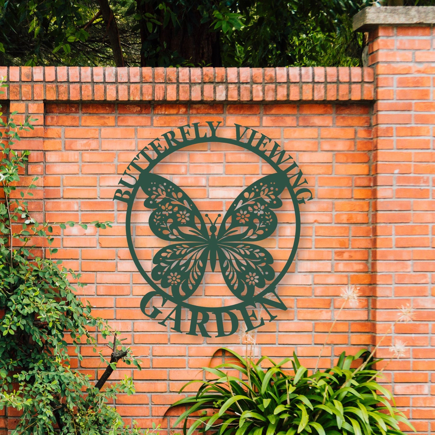 Brick wall with a metal butterfly design and 'Butterfly Viewing Garden' text.