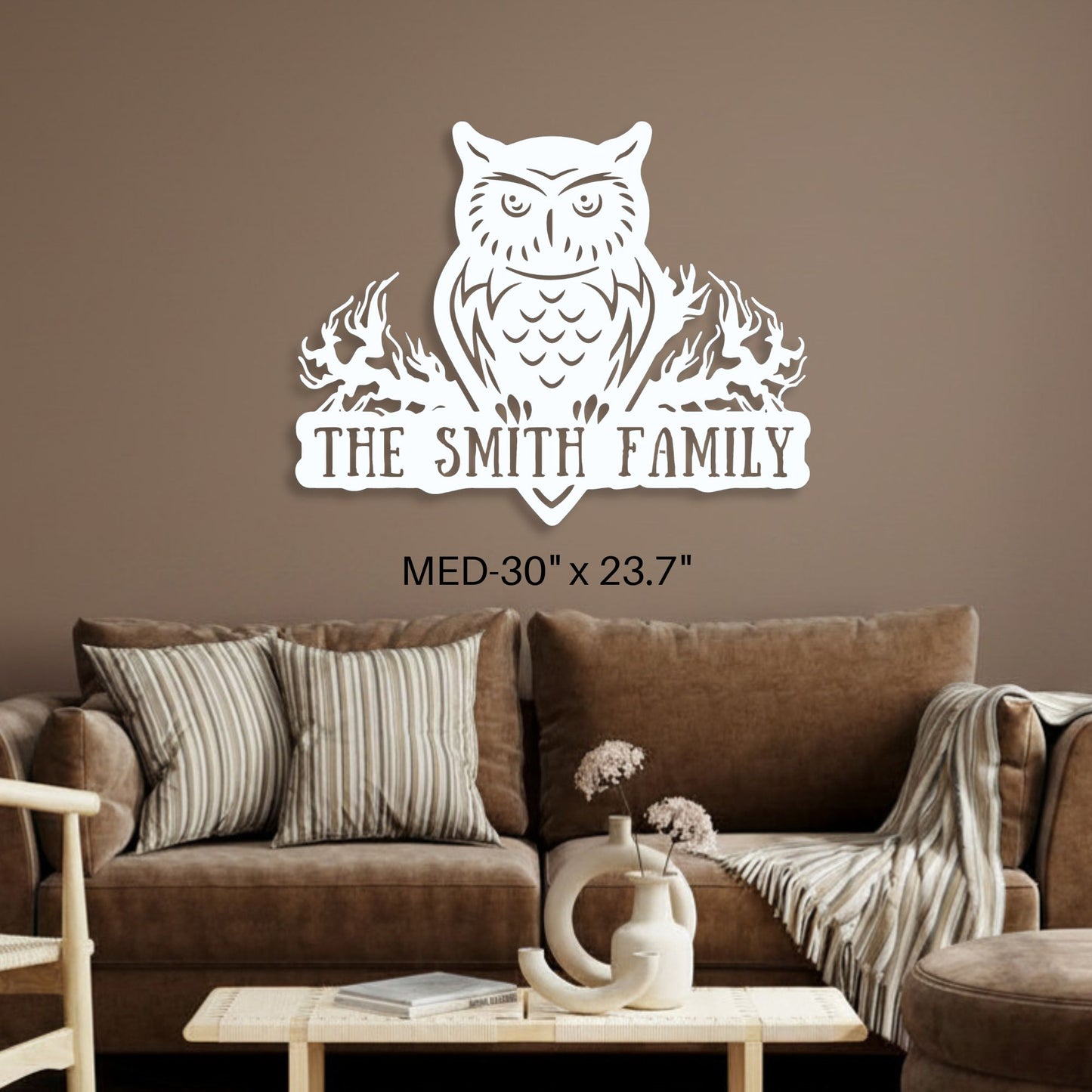 Wall decal with an owl design and 'The Smith Family' text in a living room setting.