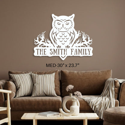 Wall decal with an owl design and 'The Smith Family' text in a living room setting.