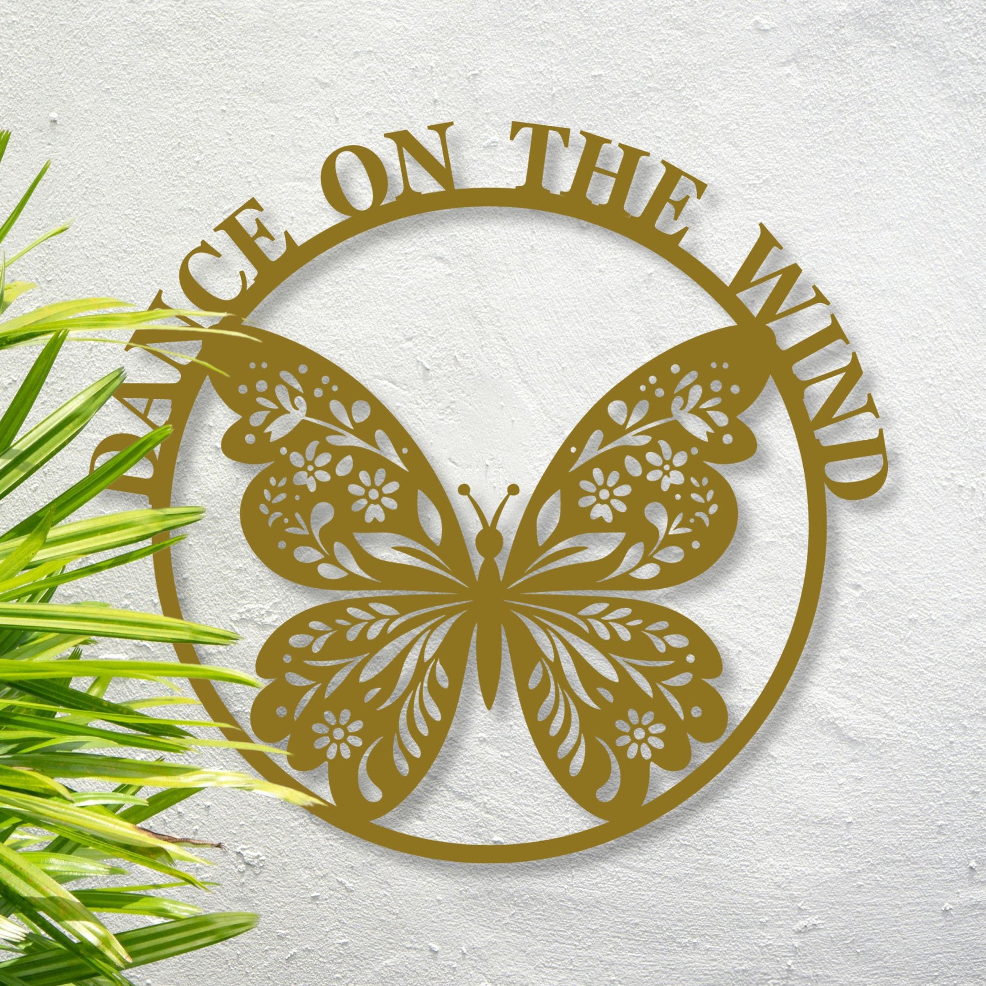 Decorative metal butterfly with 'Peace on the Wind' text on a textured white background