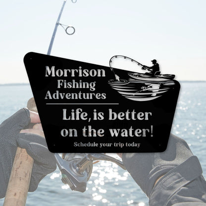 Fishing rod with a sign reading 'Morrison Fishing Adventures Life, is better on the water! Schedule your trip today' over a blurred fishing scene.