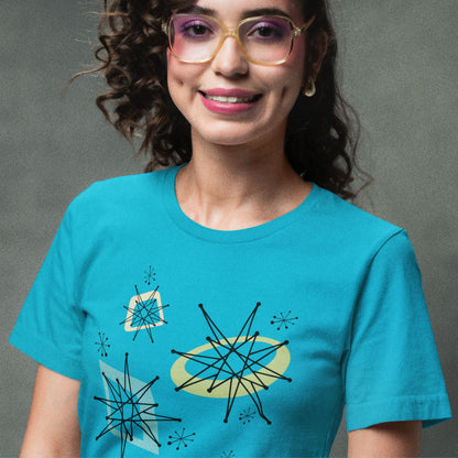 Person wearing a blue t-shirt with abstract designs on a gray background