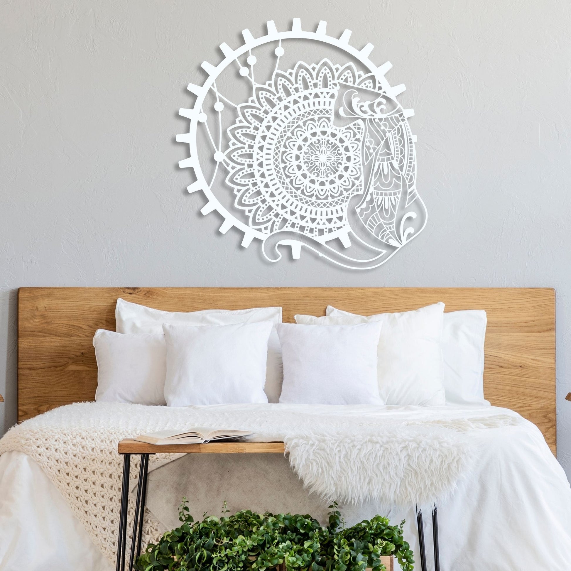 Decorative wall art above a bed with white bedding and wooden headboard.