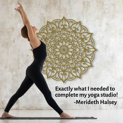 Woman in black yoga attire performing a pose with a decorative wall mandala and quote from Merideth Halsey.