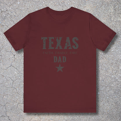 Maroon t-shirt with 'TEXAS FAMILY FIRE DAD' text on a textured surface