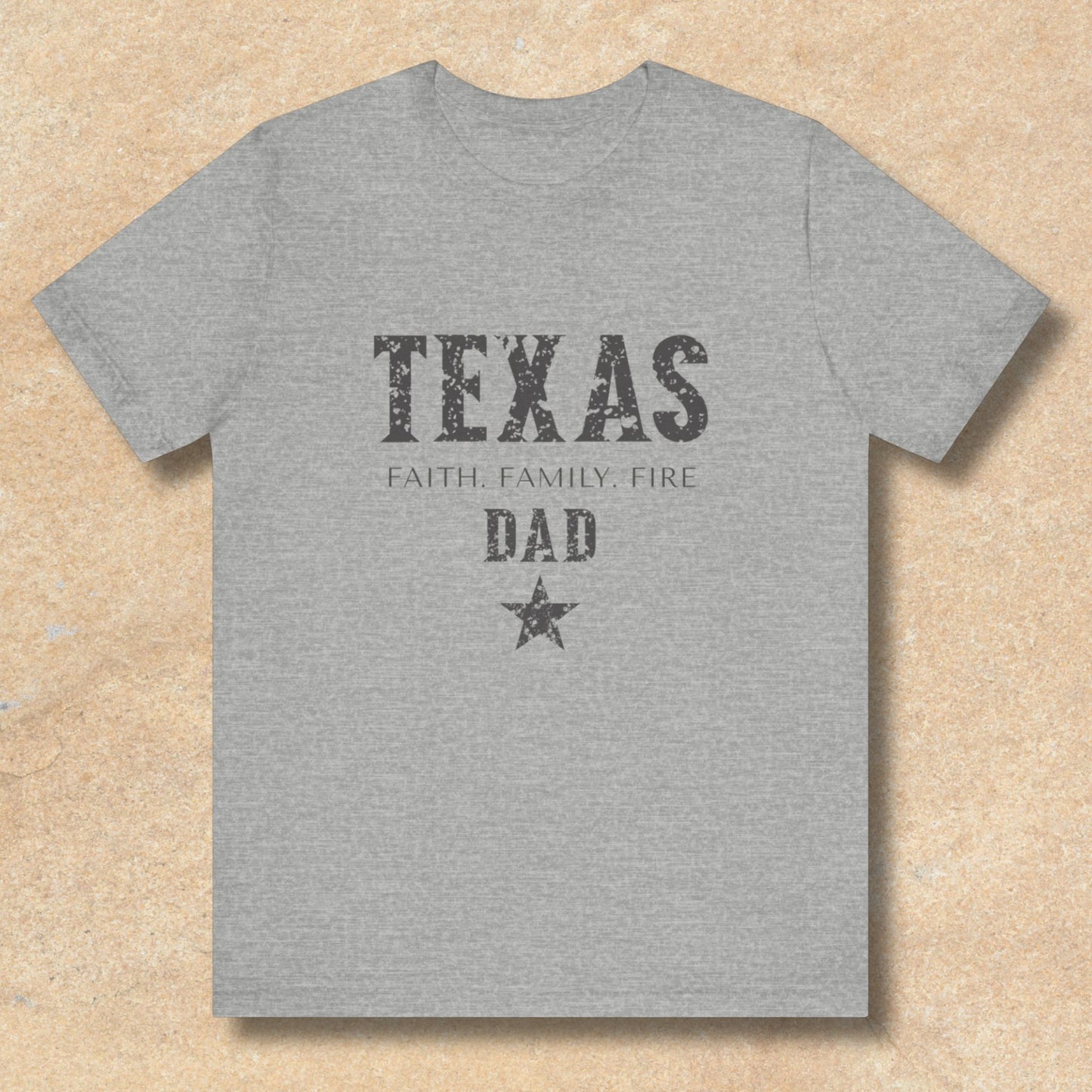 Gray t-shirt with 'TEXAS FAITH FAMILY FIRE DAD' text on a beige background