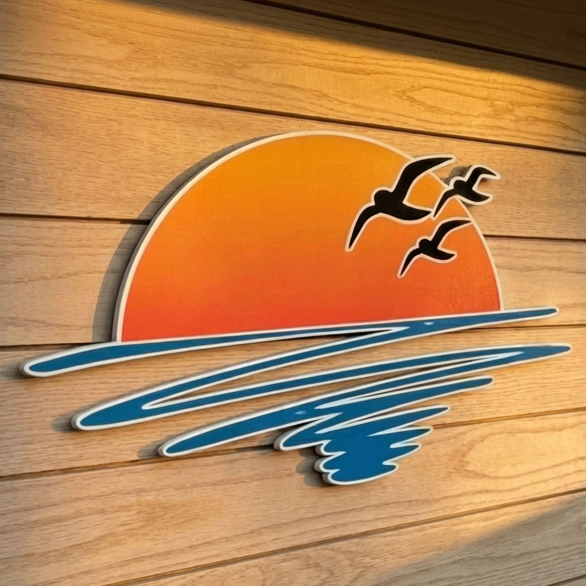 Decorative sunset and birds on a wooden background