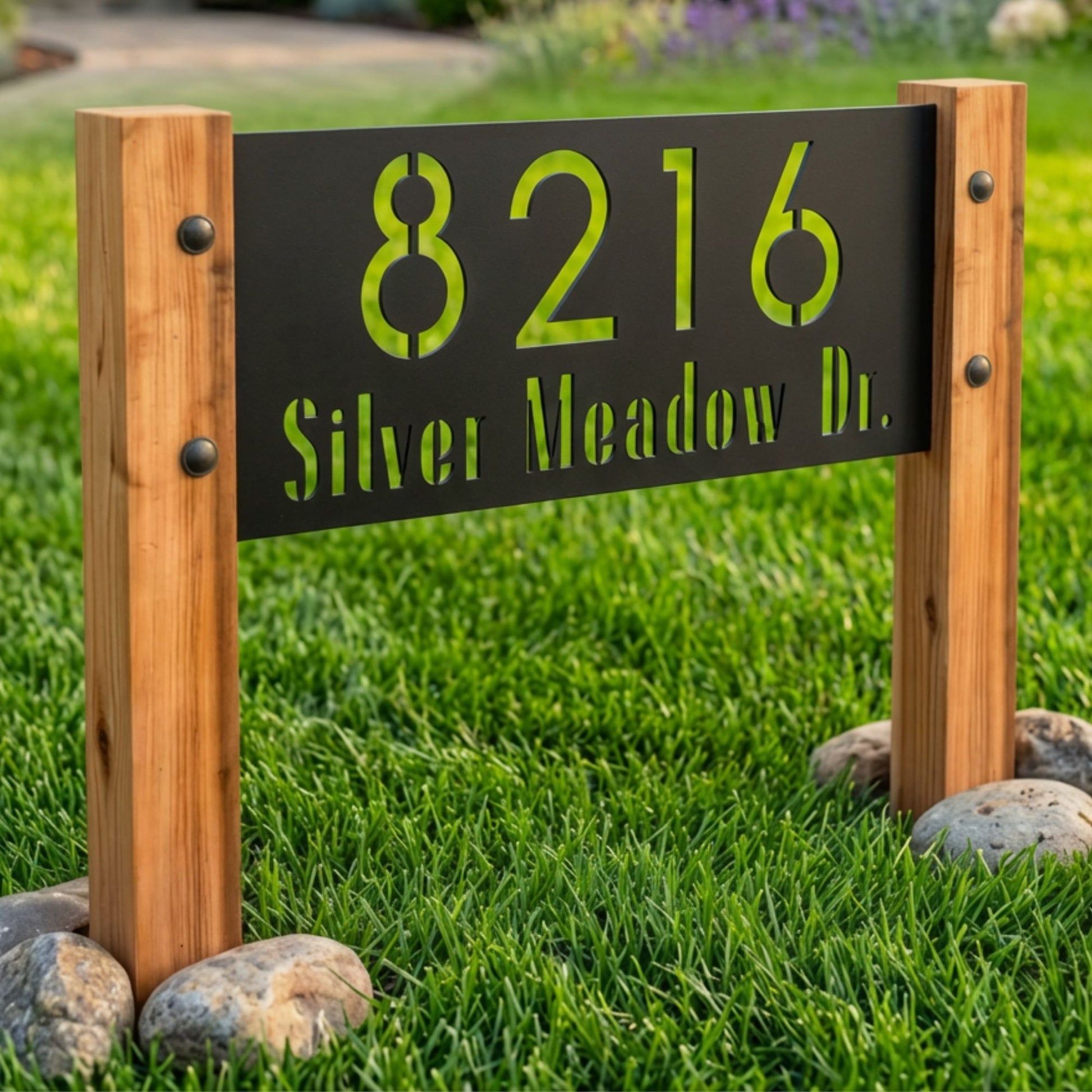 House number sign with '8216 Silver Meadow Dr.' on a grassy background