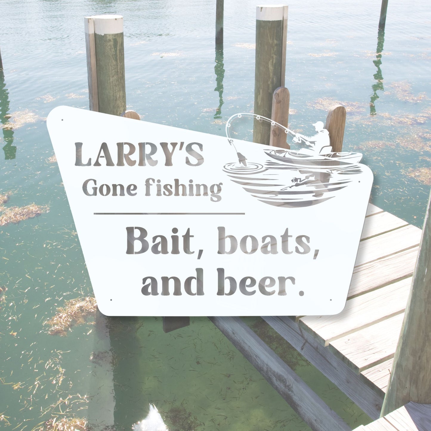 Fishing-themed sign on a dock with water and posts in the background