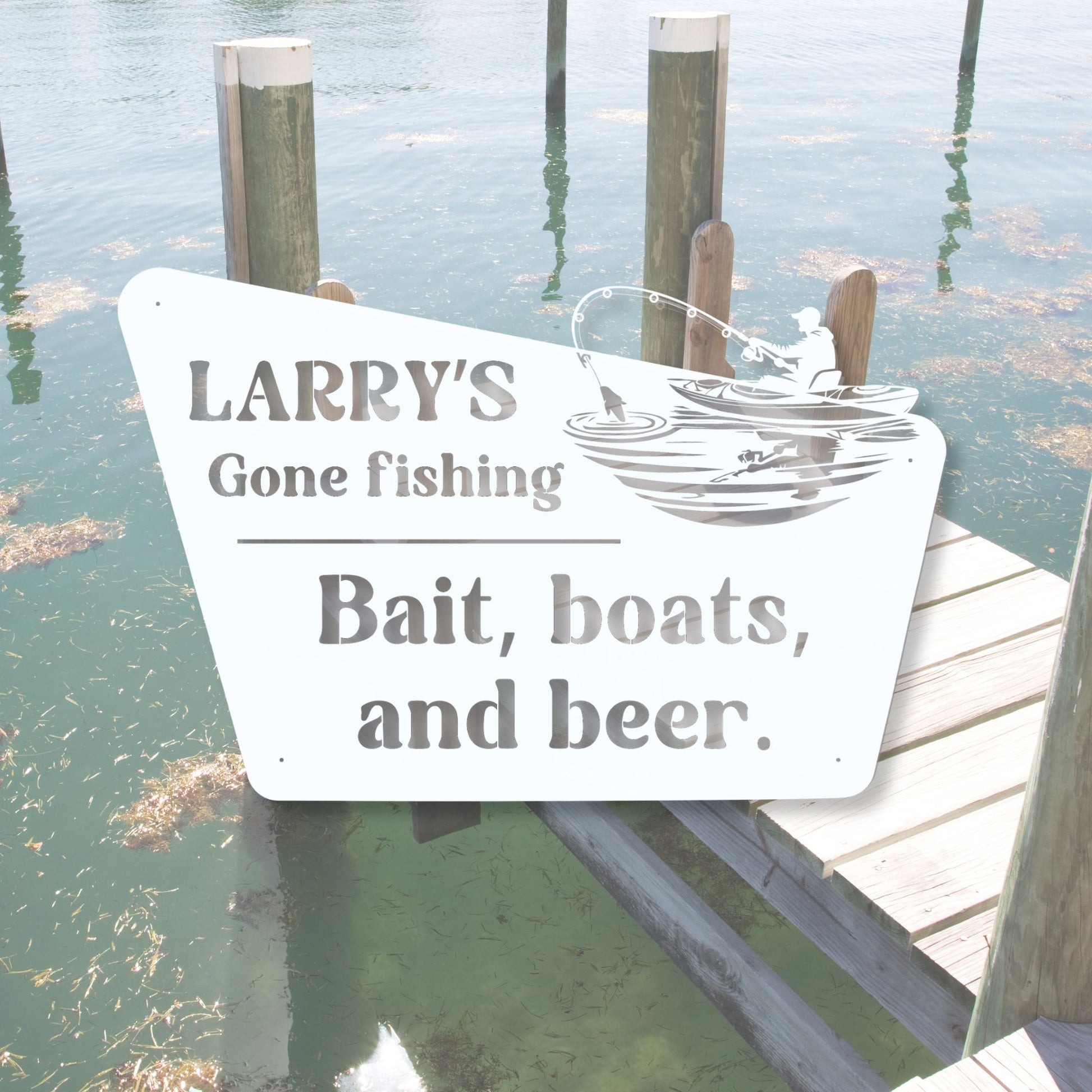 Fishing-themed sign on a dock with water and posts in the background