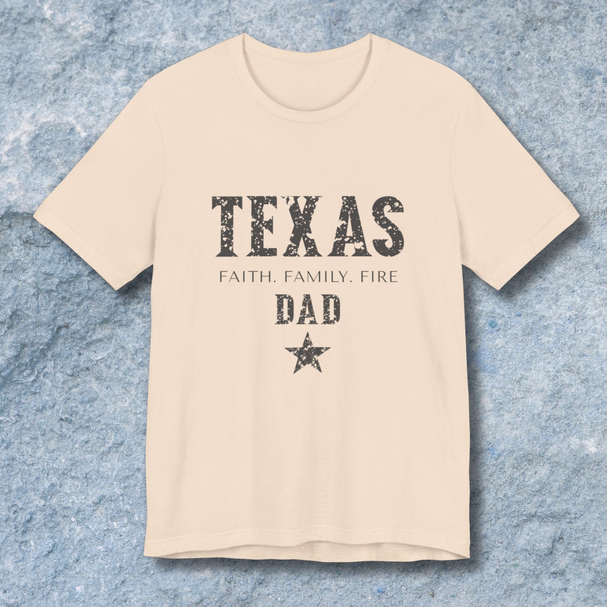 Beige t-shirt with 'TEXAS FAITH. FAMILY. FIRE DAD' text on a textured blue background